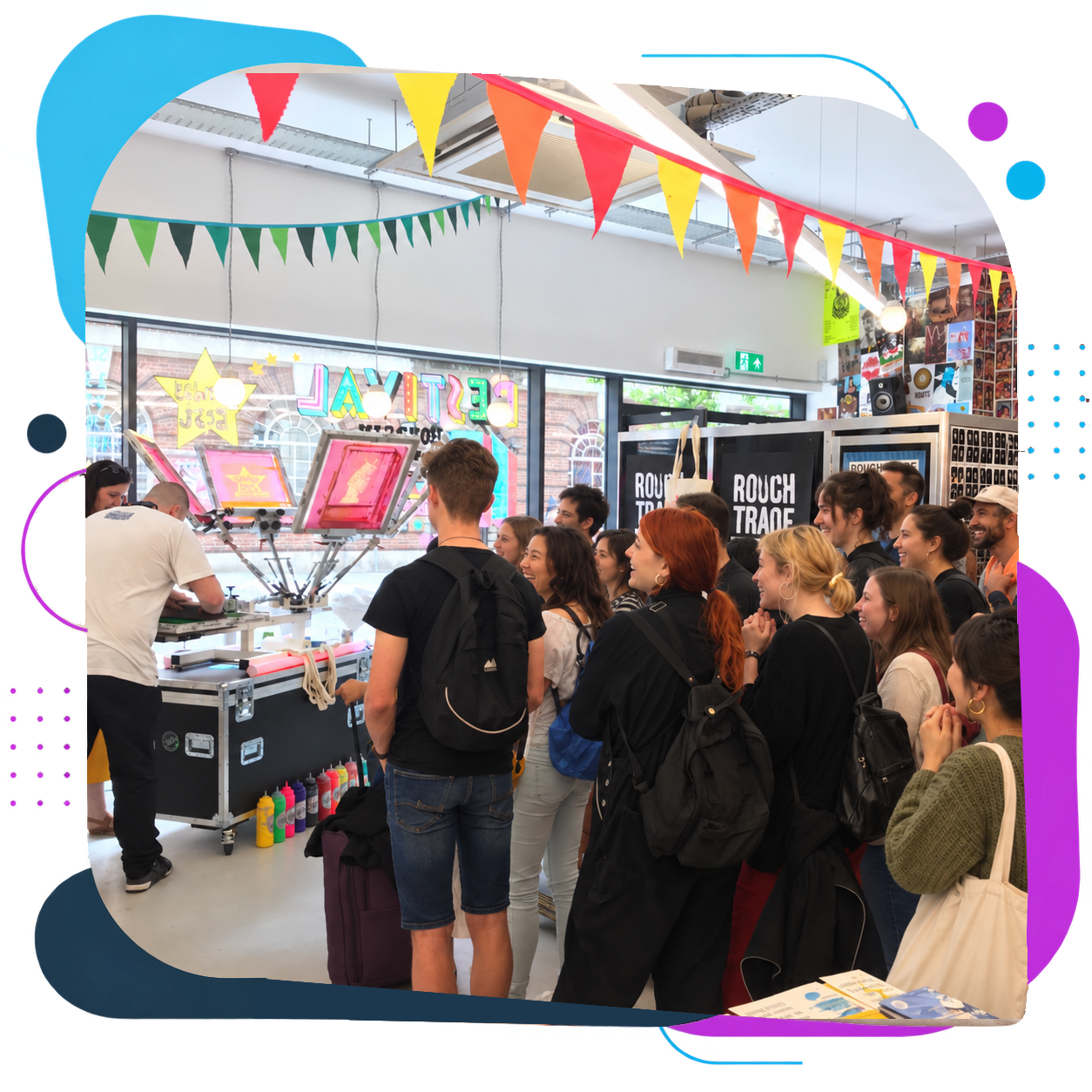 Shoppers smile and watch as a Live Ink printer pulls a live screen print in the Rough Trade record store